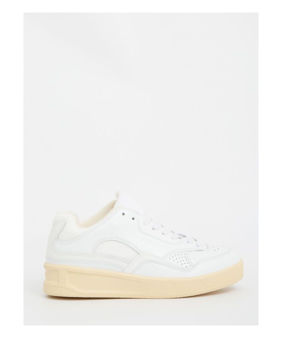 Cream-colored calfskin sneakers with vulcanized rubber sole. They feature Jil Sander logo on the side and embossed on heel, lace-up closure and perforated details. 