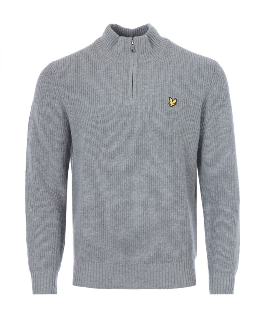 The Lyle & Scott Vintage collection takes you back in time from the modern day so that you can wrap yourself up for winter in classic pieces that have already proven they can stand the test of time. The zip up, funnel neck half zip sweater is versatile piece in a thick knit that will keep you warm whilst maintaining an air of class. The lambswool x nylon blend offers all the benefits of lambs wool without the worry of shrinking, an all over ribbed knit with thicker rib trims. The funnel neck adds warmth and sophistication in a simple silhouette. Finished with the highly recognisable, yet subtle,  Lyle & Scott eagle applique on the chest. Regular Fit, Cotton/Nylon Blend, Half Zip Detail, Long Sleeve, All Over Ribbed Knit, Lyle & Scott Branded Applique . Style & Fit:Regular Fit, Fits True to Size. Composition & Care:50% Lambswool, 50% Nylon, Machine Washable.