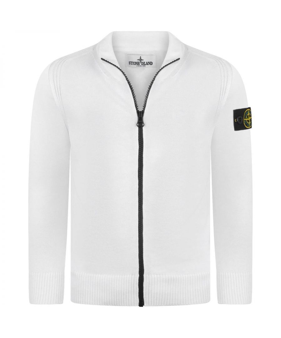 Stone Island boys zip up top in an ivory hue with a stand up collar, cuffs and hemline and the signature compass patch decorates the sleeve. Style with a pair of Stone island jeans to complete the look.