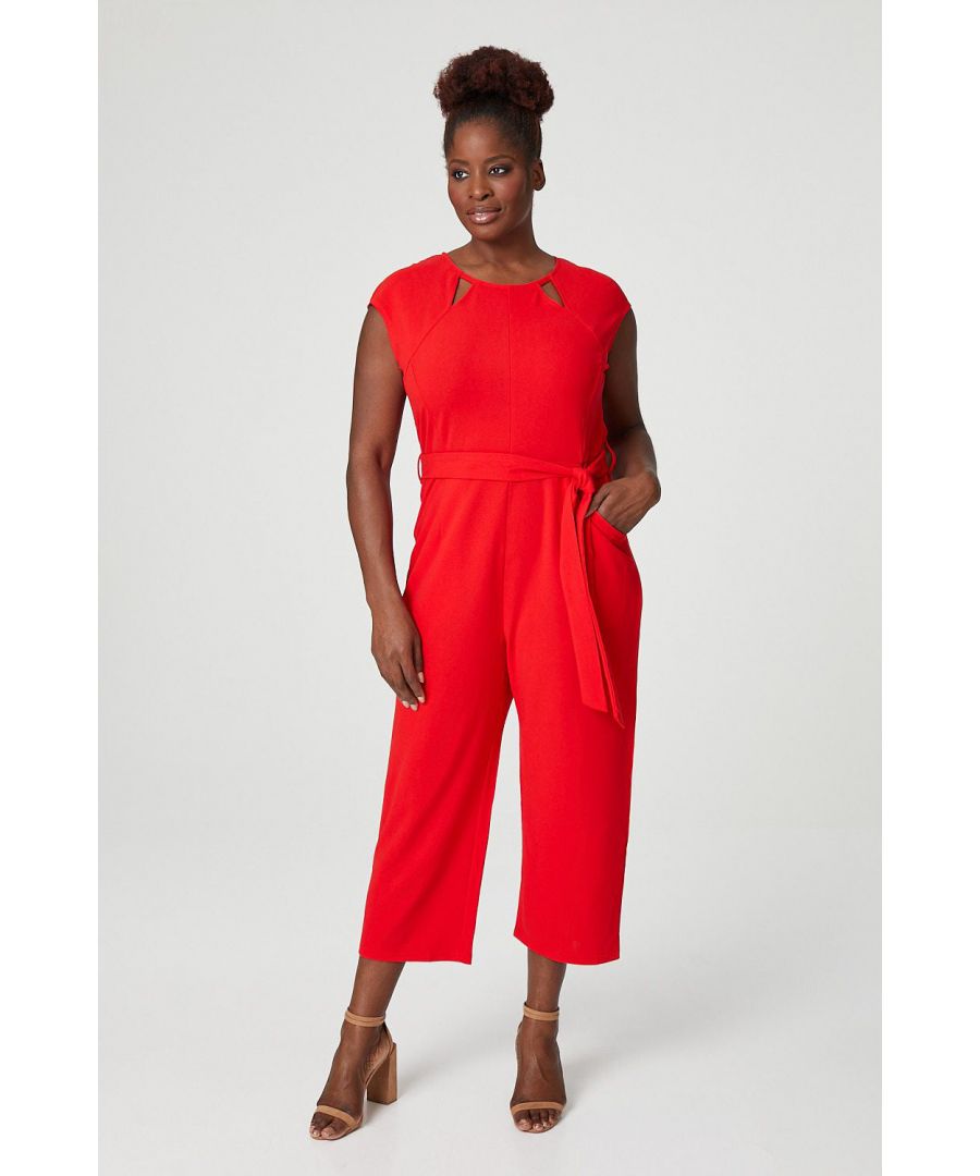 This slim fitting jumpsuit if perfect for a night out or for a special occasion. It has a round neck with cut outs, a tie waist belt and cap sleeves. Wear with metallic accessories.