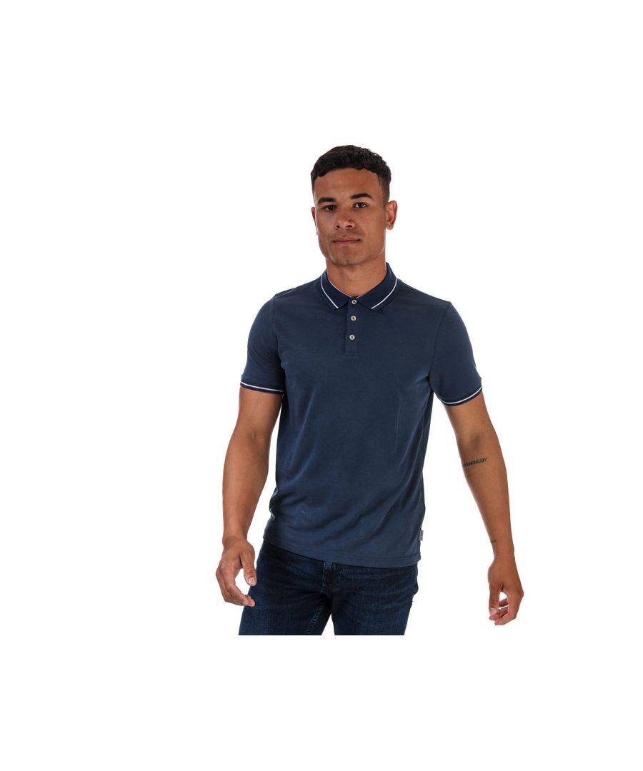 Mens Ted Baker Gelpen Soft Touch Polo Shirt in blue.- Ribbed polo collar.- Short sleeves with ribbed arm cuffs.- Three-button placket.- Contrasting stripe detailing to the neck and arms.- Soft touch fabric.- Straight cut hemline.- 64% Modal  36% Polyester. Machine wash at 30 degrees.- Ref: 249615MIDBLUE