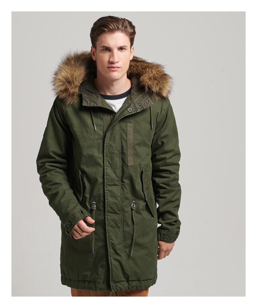 Military style is a staple of vintage fashion for its reliability, comfort, and practical fit. When it comes to preparing for an adventure, these traits are essential, and the Military Faux Fur Parka jacket is the perfect solution. It features luxuriously soft borg lining to help keep you cosy without compromising on mobility, thanks to its military inspiration and durable, minimalistic exterior. And because of its detachable faux fur trim and double fastening, this jacket's versatility is matched only by its reliable style, easily fitting over any look so that you can stay warm to and from your cold day occasions.Relaxed fit – the classic Superdry fit. Not too slim, not too loose, just right. Go for your normal sizeBungee cord adjustable hoodDetachable faux fur trimZip and popper fasteningButton adjustable cuffsBungee cord waist adjusterTwo front popper pocketsBungee cord adjustable hemLined hood and sleevesBorg-lined upper bodyQuilted lower body liningInternal pocketSignature Superdry patch on the right shoulderSignature Superdry tab on the left sleeve