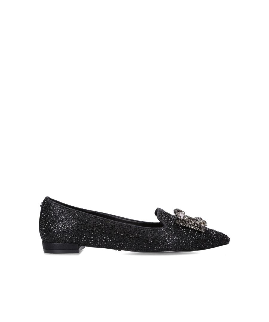 The Celebrate is a flat shoe. The upper is completely embellished with black sequins as well as a smoked crystal hardware on the toe, Gunmetal C pin stud on the heel. This product features 'All Day Long' technology.