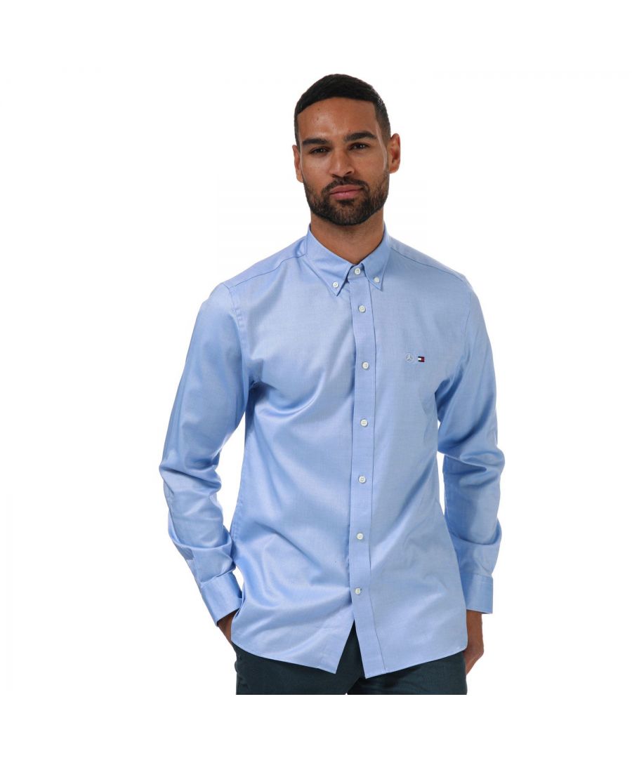 Mens Tommy Hilfiger Mercedes Benz Oxford Long Sleeve Shirt in blue.- Button-down collar.- Long sleeves.- Full button fastening.- Button cuffs.- Mercedes logo andTommy Hilfiger's flag on the chest.- 96% Cotton  4% Elastane. Machine washable.- Ref: TT0TT05787CI6