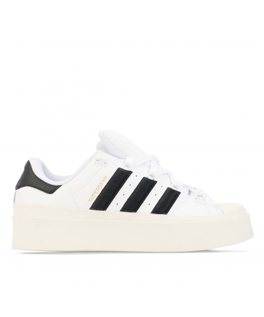 Womens adidas Originals Superstar Bonega Trainers in footwear white - core black.- Coated leather upper.- Lace closure.- Regular fit. - Embroidered 3- Stripes.- Memory foam sockliner. - Textile lining. - EVA drop-in.- Ref.: GY5250