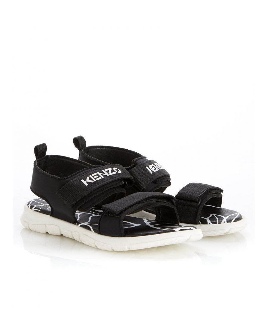 • Upper: Polyurethane \nSole: Rubber  • Kids Logo Sandals by Kenzo \nBlack \nThese strappy sandals have arrived just in time for the summer, a sleek and sporty style that kids are sure to love \nDouble velcro strap design \nFeatures Kenzo branding to the top strap\nOpen toe\nShort pull tab to the heel  \nCushioned footbed \nDurable rubber sole • Velcro Closure