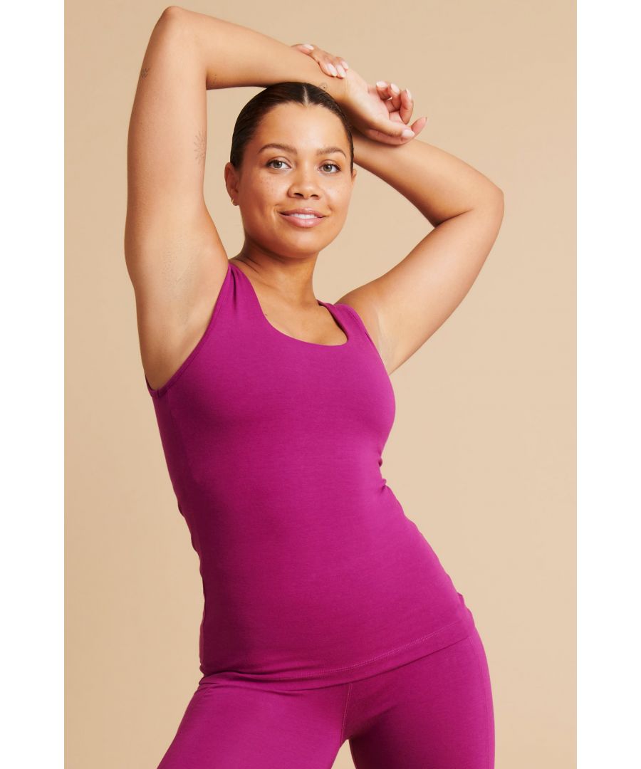 Our Peace Vest is a work out essential, with thick straps and a built-in-shelf bra, making it perfect for even your toughest class.\n\nDesigned for Yoga and Pilates\nFlattering, deep scoop back\nPerfect low impact style\nSquare neck tank for a sleek silhouette\nMade with Bambor®, our unique blend of 60% Bamboo, 30% GOTS Organic Cotton, 10% Elastane\nNaturally breathable and sweat-wicking\nGreat for all sporting activities 