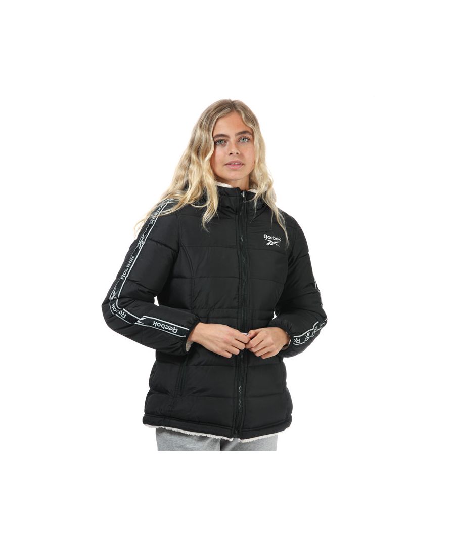 Womens Reebok Reversible Puffer Jacket in black.- Full-length zipper.- Fully reversible with sherpa fabric inside.- Two zipped pockets.- Water-repellent and wind-resistant polyurethane coating.- Comfort fit.- Shell: 100% Polyester. Lining: 100% Polyester. Filling: 100% Polyester. Machine washable. - Ref: EX2963