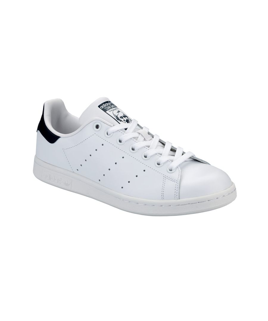adidas Originals Stan Smith Trainers in white.High-end casual footwear with an affordable price tag.These Stan Smith trainers from adidas Originals are iconic shoes loved by many. Crafted with a full grain leather upper  the Stan Smiths are fitted with perforated 3-stripes to each side and a tonal rubber outsole. A clean and minimal design  these shoes are finished with branding to the heel in navy.Leather upper. Synthetic sole.Ref M20325