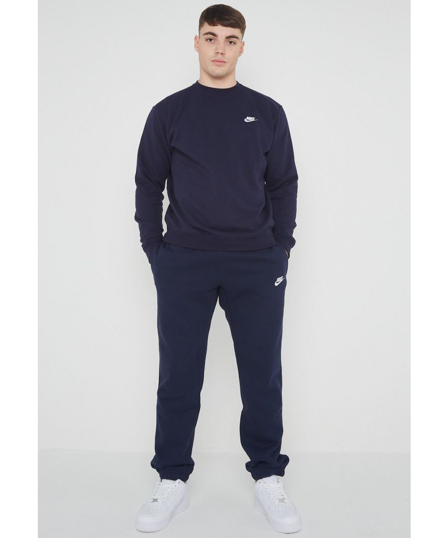 Nike Mens Crewneck Clubfleece tracksuit set.           \nCrafted from a Brushed Back Fleece.           \nRibbed Crewneck, Cuffs and Waist.          \nClassic Nike Logo Embroidered on the Left Chest.               \n80% Cotton, 20% Polyester.           \nMachine Washable.           \nAvailable in Black, Navy, Grey.