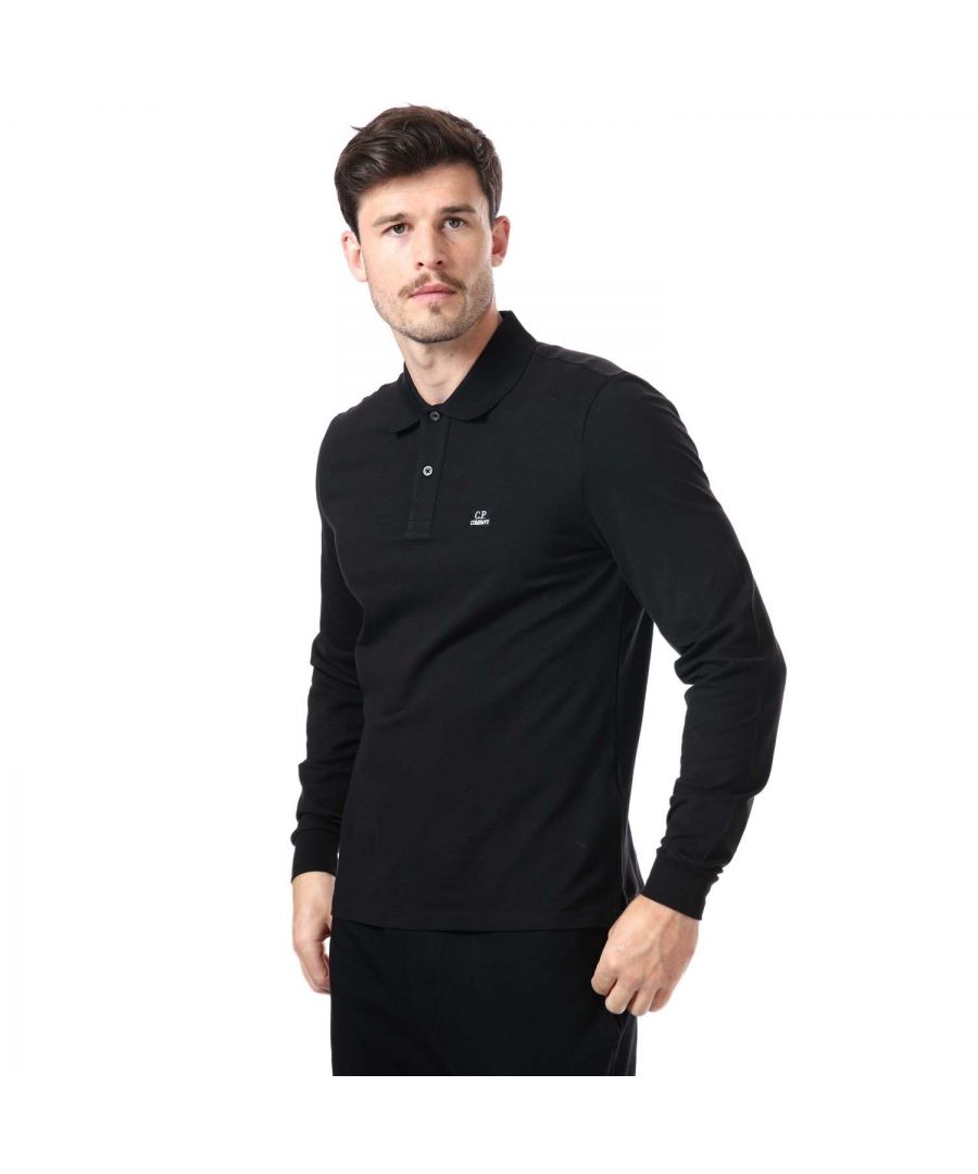 Mens C.P. Company Stretch Pique Long Sleeve Polo Shirt in black.- Classic collar.- Two button placket.- Long sleeves.- Ribbed cuffs and collar.- Logo badge at chest.- Stretchable cotton pique.- Regular fit.- 95% Cotton  5% Elastane. Machine wash at 30 degrees.- Ref: 13CMPL073A999