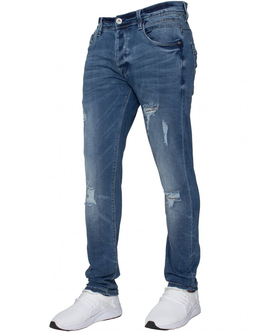 Fresh of the press these mid stonewash denim hyper stretch jeans are the perfect addition to your summer wardrobe, featuring subtle stitching design to back pockets and leather waist branded label to back. 5 Classic style pockets including a coin pocket and button fly, contrast stitching detail throughout. Distressed and ripped detail to front to complete the look. Made primarily from cotton (85%) with 13% tencel and a touch of spandex, these jeans showcase 100% comfort. Best worn with our summer tops and converses.