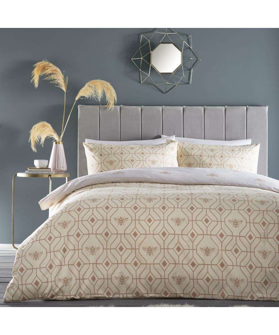 A subtly geometric honeycomb patterned duvet set, on a champagne background, featuring buzzing bees and ideal for a neutral setting. The reversible design offers an alternative pattern to choose from. The choice is yours!