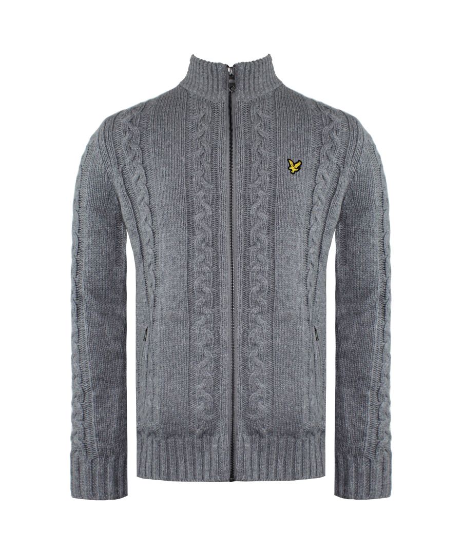 When the temperature drops and you need a go-to knitted layer, grab the Lyle & Scott men's Cable Knit Zip Through Cardigan. A vintage style knit with practical features and the iconic eagle at the chest. The lambswool blended construction is super soft and warm, whilst the full zip closure means you can get the most from this cosy piece, even on the coldest of days. Layer with a wool coat for ultimate warmth.