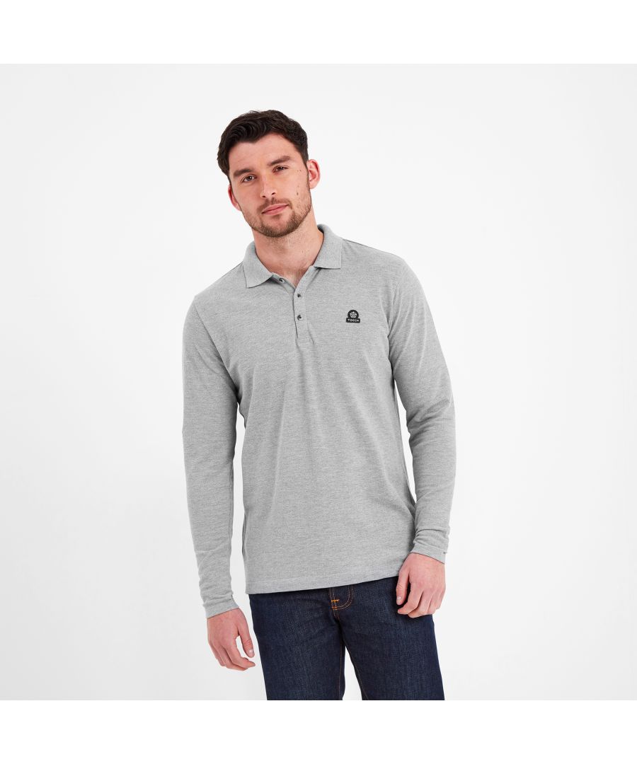 Made from pique fabric, our Bander is a long sleeve polo shirt for men that is beautifully textured on the outside, yet soft and smooth on the inside. A versatile style staple that can be worn all year round, the flat knit rib collar makes Bander ideal for layering underneath a jumper or jacket when the weather is changeable. Bander comes in supersoft 100% sustainable cotton that’s better for the planet and kinder to your skin too. Designed by our team in West Yorkshire in colours inspired by the rugged Yorkshire landscape, this everyday polo shirt is perfect teamed with jeans and boots and is finished with branded buttons and an embroidered TOG24 rose on the chest.
