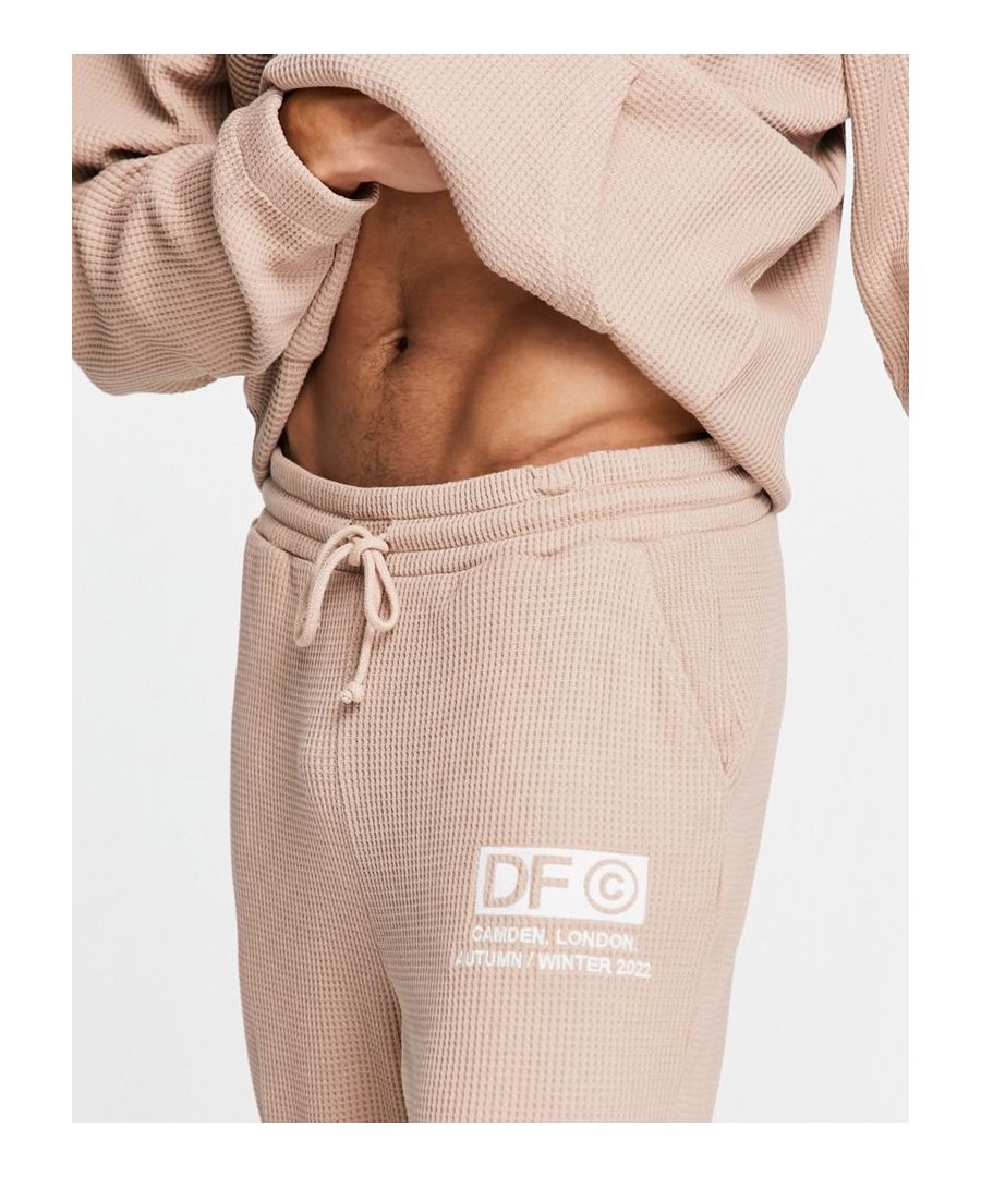Joggers by ASOS DESIGN Part of a co-ord set Hoodie sold separately Elasticated drawstring waist Functional pockets Logo embroidery detail Relaxed fit Sold by Asos