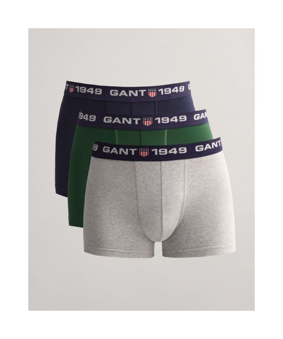 Our 3-Pack Retro Shield Trunks come in cotton stretch jersey with a close fit, short legs, and a normal waist. Designed in solid basic colours, these trunks have a jacquard-knitted elastic waistband with repeated GANT shield logos.\n\nClose fit\nShort legs\nNormal waist\nJacquard-knitted elastic waistband\nMaterial: Cotton 95%, Elastane 5%\n\n \nItem No. 902233453