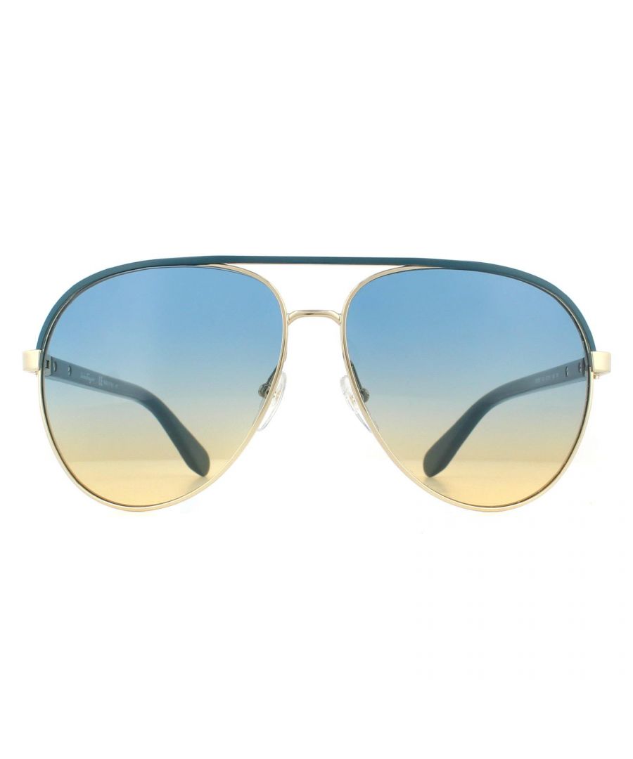 Salvatore Ferragamo Sunglasses SF163S 741 Shiny Gold Turquiose Blue to Yellow Gradient are a feminine aviator style with an enamelled top bar, and buckle hinges with Ferragamo branding engraved. Plastic temples and adjustable silicone nose pads guarantee a comfortable fit.