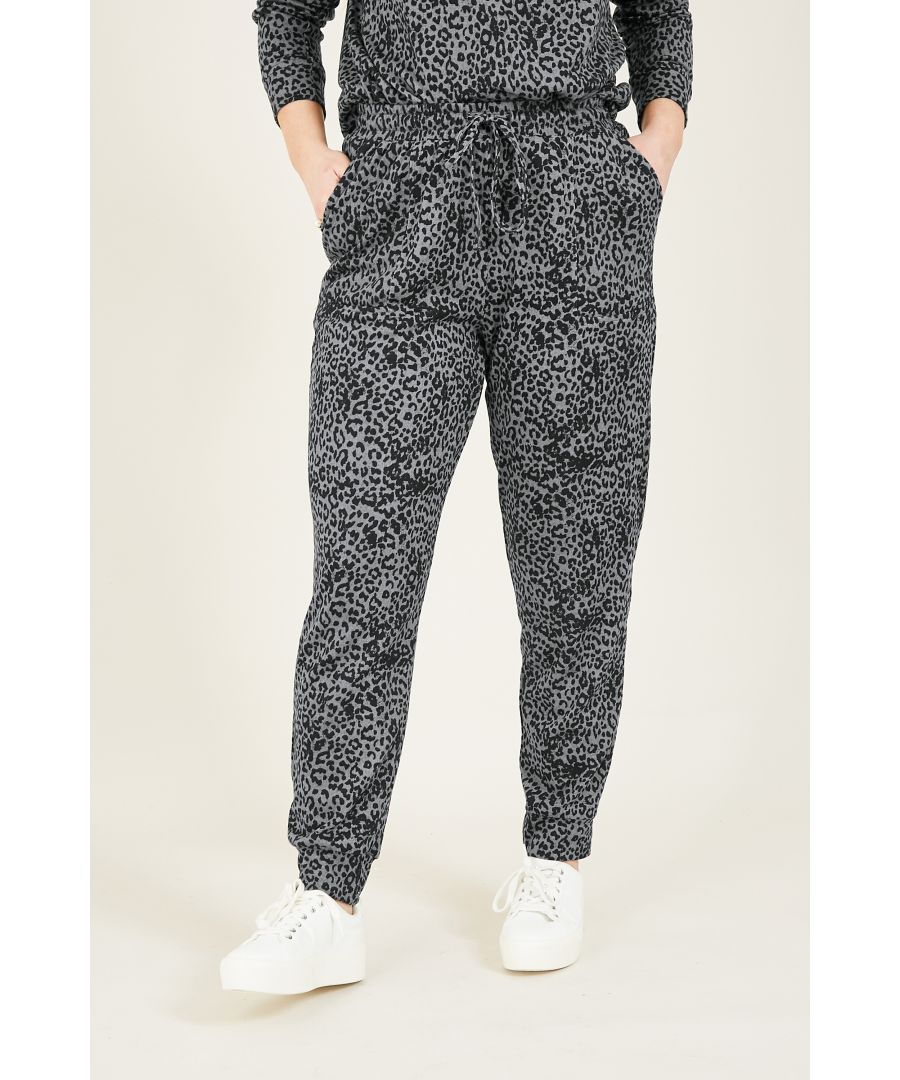 Update your loungewear collection with this Yumi Animal Print Loungewear Joggers. Expertly crafted from soft jersey fabric, they're cut to a tapered shape with a fitetd drawstring waistline. The leopard print adds a modern touch, complemented by cinched cuffs to keep your look on-trend. Pair with the matching co ord sweatshirt for the ultimate cosy finish.  95% Polyester 5%Elastane Machine Wash At 30
