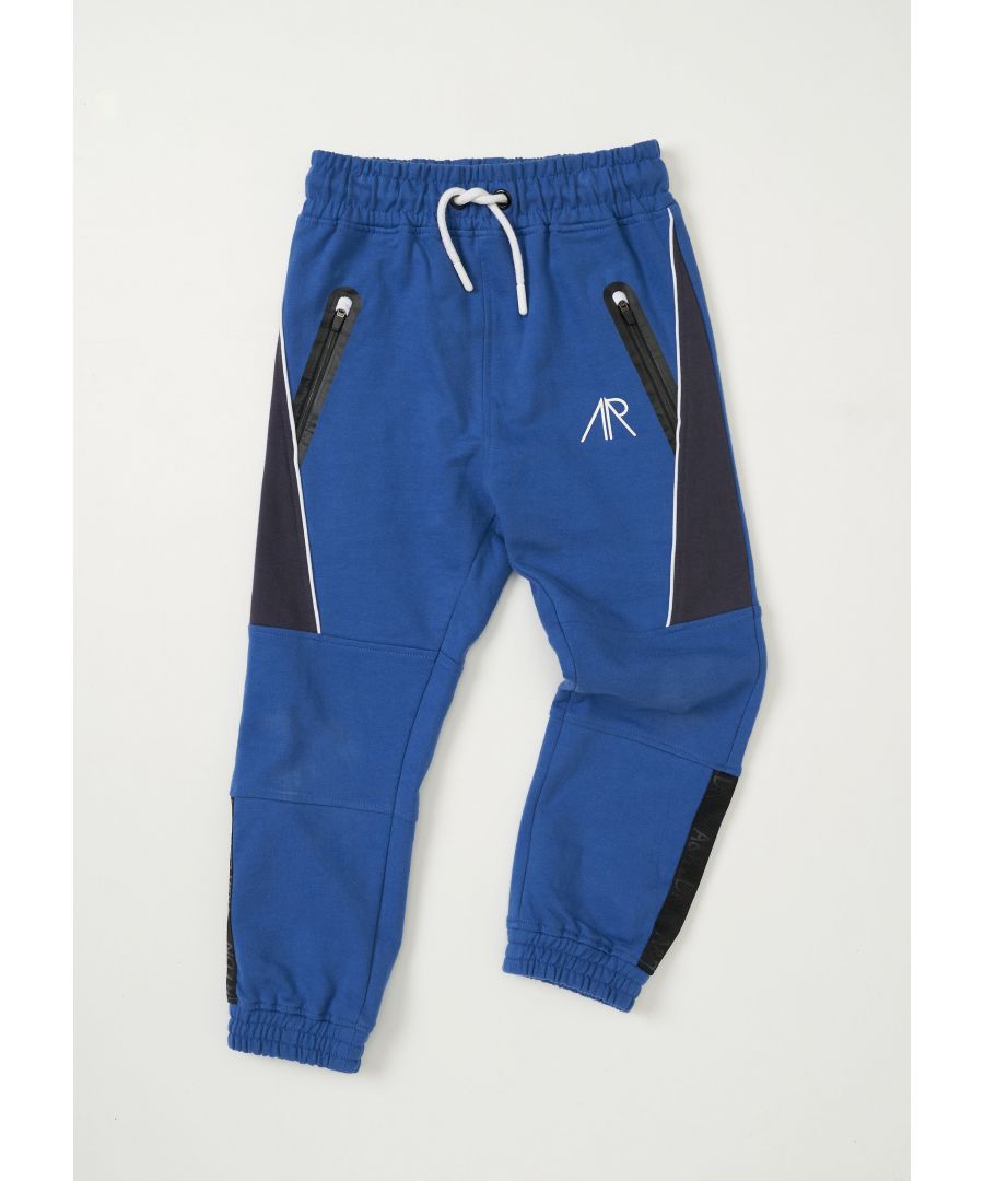 Super cool chevron panel joggers. In contrasting blue super soft sports jersey. Performance zips and high build branded logo. Elasticated waist with functional draw cord.  Model wears 9y  he is 10 years old and 140cm tall.  Angel & Rocket cares - made with Fairtrade cotton  Colour: Blue  About me: 100% Polyester  Look after me: Think planet  wash at 30c