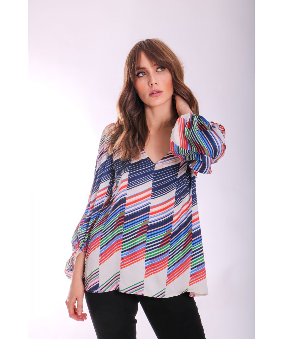 Crafted from a satin fabric in a loose silhouette, the Mollie blouse is patterned with an intricate geometric design filterering through as a nod to 70s inspired design, finished with a flattering v-neckline. 100% Polyester