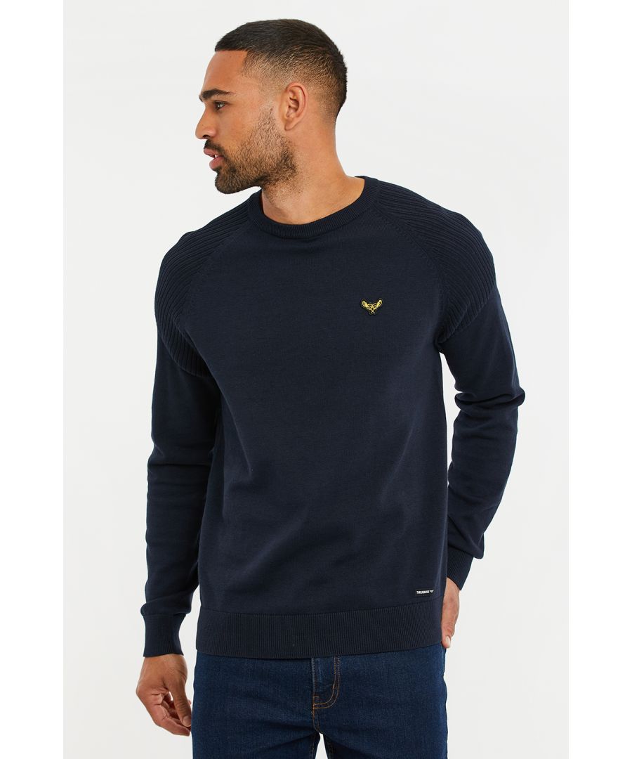 This fine knit, crew neck jumper from Threadbare features ribbed detailing on the shoulders and sleeves. This style has ribbed cuffs and hem and is finished with the Threadbare signature logo on the chest. Perfect for all year-round, team up with jeans or chinos to complete the look.