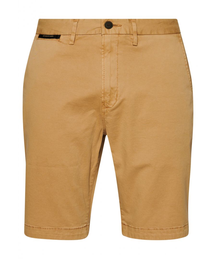 Chinos are a summer essential. Whether you're going for a smart dinner look or for a walk along the beach our Studio Core Chino Shorts will have you sorted for any occasion.Slim fit – designed to fit closer to the body for a more tailored lookOrganic cottonButton and zip fasteningBelt loopsFour pocketsSignature logo badgeMade with organic cotton grown using natural rather than chemical pesticides and fertilisers. The healthier soil this creates uses up to 80% less water which is better for our planet and for the farmers who grow it.