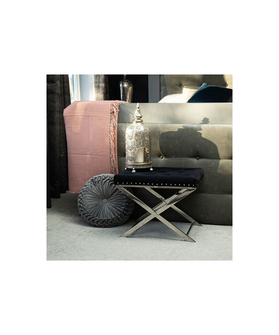 Embracing the chic elegance of minimalism, with a meticulous quilted black design, this stool is an astute, space-friendly seating addition to any home. Quilted and generously padded, know you can rest in comfort as you apply your maquillage in your boudoir, or rest your feet for hours, propped on this minimalistic quilted stool.\n \nLightweight and highly manoeuvrable, it can be housed in many rooms across the home. Clad in a sleek black finish and resting on two silver criss-crossed legs, the colour scheme of the quilted stool ensures a simple and seamless addition to any interior space, so you can shift and alter the position of this seat to your heart’s content.\n \nFeatures: \n\n\nSilver-toned stands\n\n\nBlack quilted seat surface\n\n\nMinimalistic design\n\n\n \nProduct specification: \n\n\nProduct Type: Stools\n\n\nWeight: 4.90kgs\n\n\nDimensions: H60cm x W40cm x D48cm