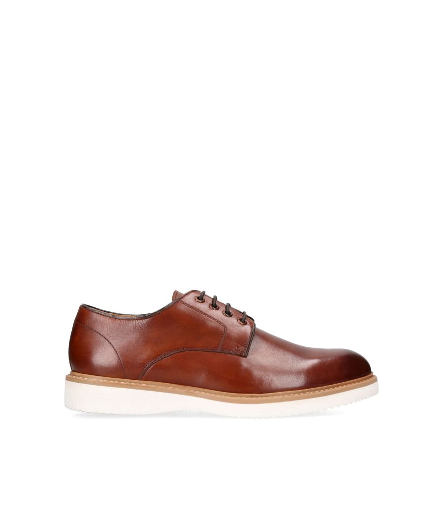 The Finley is a tan leather shoe. The upper laces up with bronze eyelets.
