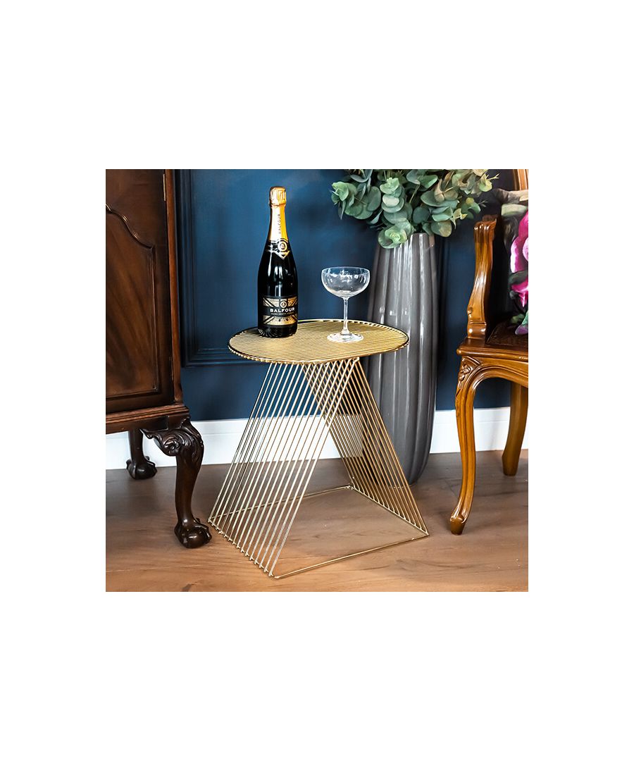 An inventive reimagining of the classic coffee table, this metal wire creation can be used as a stool, or for decorative purposes to stack books or magazine. Its gold colouring makes this table ideal for adding a contemporary flourish to classic interiors or emboldening more modern decor.\n \nThe classic coffee table meets a utopian revisioning with this gold table. Vivid and glistening from every angle , it’s almost too beautiful to be used. Propped on two slanted wired legs, it recalls the ancient Greek mythos, and whispers the question if at one point it served Sun God Apollo, perhaps holding his golden lyre.\n \nNow, at this moment in time, we bring it to you, to use for decorative purposes, or even to stack books of myth. What is fit for a god must be fit for you.\n \nFeatures: \n\n\nDual-standing legs\n\n\nGeometric lines\n\n\nShining gold body\n\n\nArt-deco inspired piece\n\n\n \nProduct specification: \n\n\nProduct Type: Side Table\n\n\nWeight: 3.33kgs\n\n\nDimension: 44.5cm x 40cm x 33cm