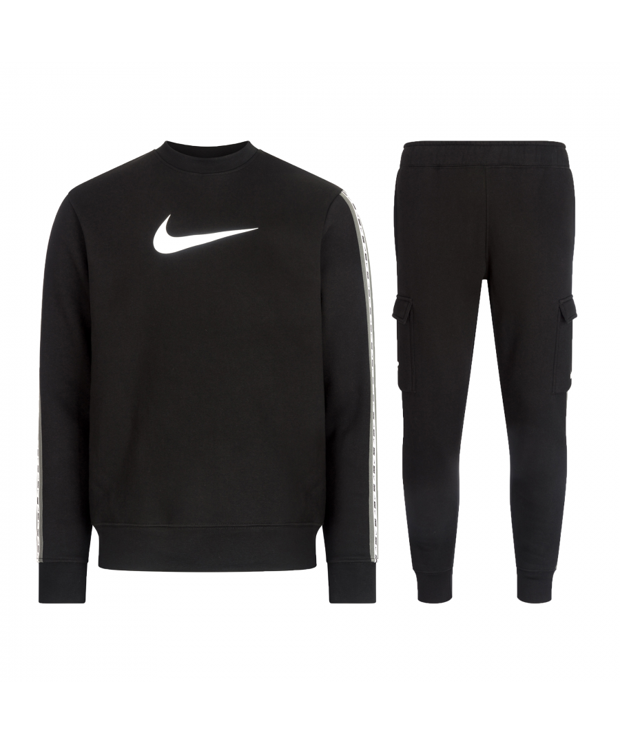The Nike Sportswear Tracksuit elevates a classic, comfortable look. Made from soft brushed back fleece for a soft and silky feel and featuring taping down the sleeve and leg for a fresh-off-the-track look. The cargo pants feature a pocket on both sides and an adjustable waist whilst the cuffed ankles add a sporty touch.