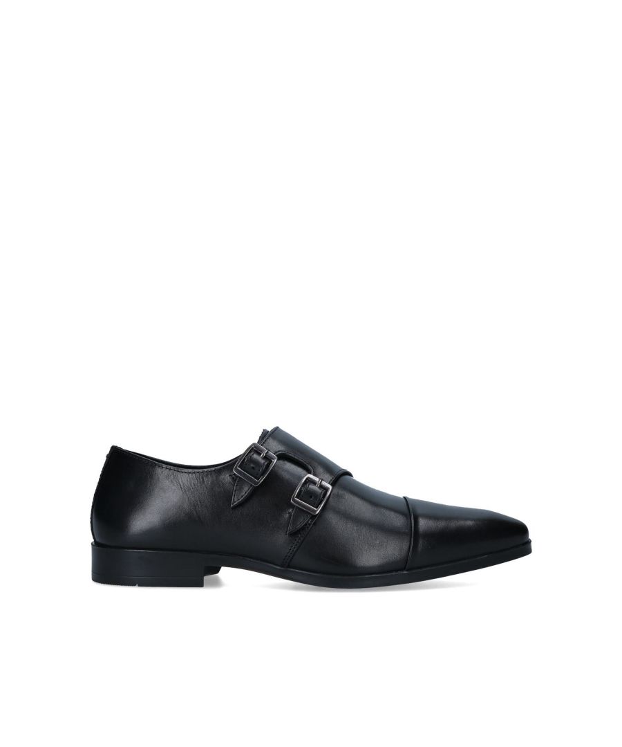The monk style Collins formal shoe is crafted from a black smooth leather. The front features two buckled straps across the front of the shoe with a raised stitch toecap detail. The heel has a slight elevation.