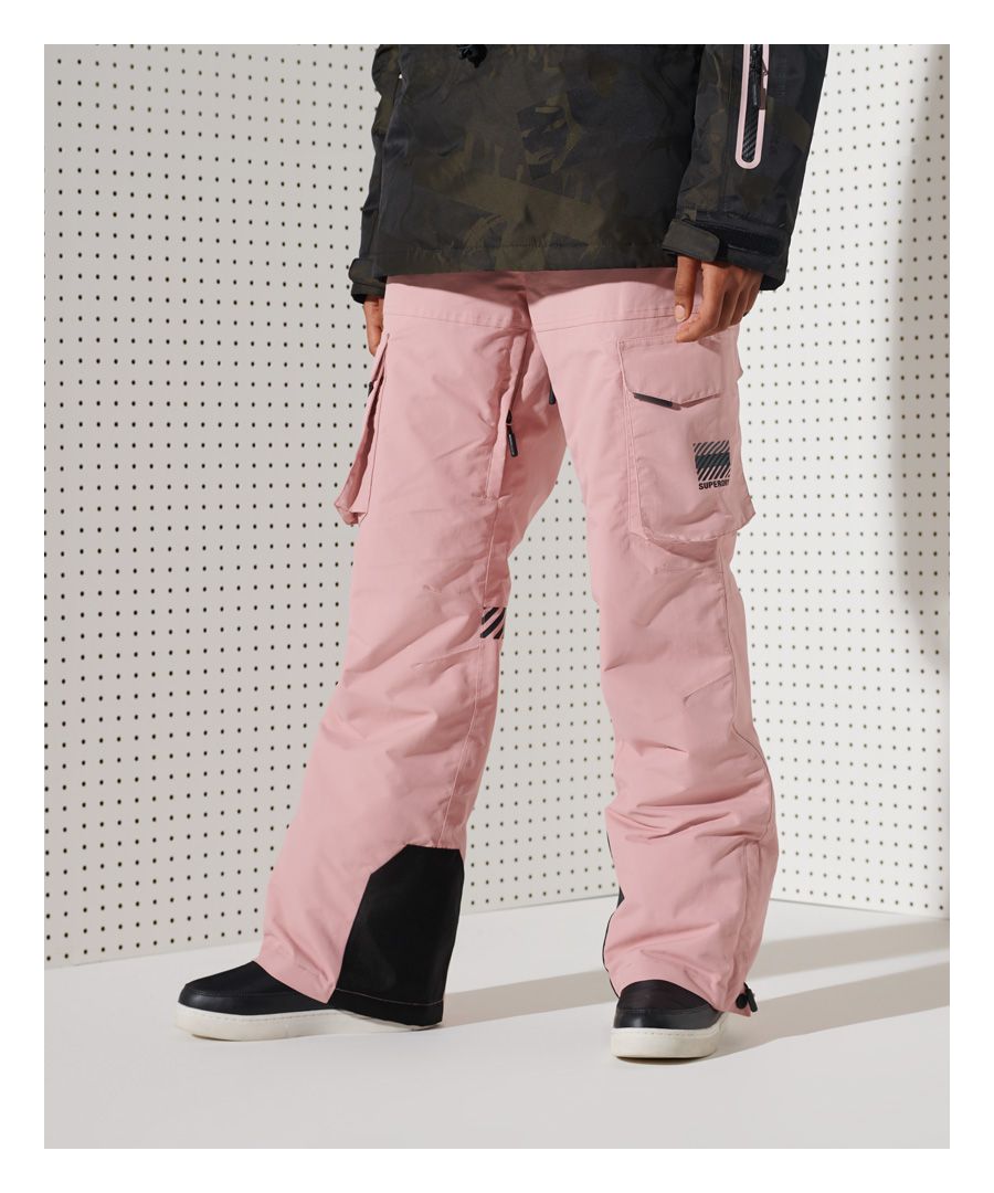 Hit the slopes in style with the Freestyle cargo pants. Made with breathable tech fabric and 10K/MM water resistance these are the perfect choice for your ski wear this season.Breathable 10k/MM - Provides airflow comfort for low to mid-level activityWaterproof 10k/MM - Rainproof and waterproof under light pressure, for light rainy daysFully taped seams - Seams have been internally taped to help prevent water penetrationDurable water repellency - This fabric has been coated with an advanced water-resistant finishSnow sealsMain zip, popper and hook and loop fasteningDrawstring and hook and loop waist adjustmentsBelt loopsSix pocket designInner thigh ventilationBoot gators with hook and loop fasteningPopper and zip ankle fasteningTextured signature logo on one pocketTextured stripe design on the back of one legEmbroidered logo on one front pocketRubber logo tabs