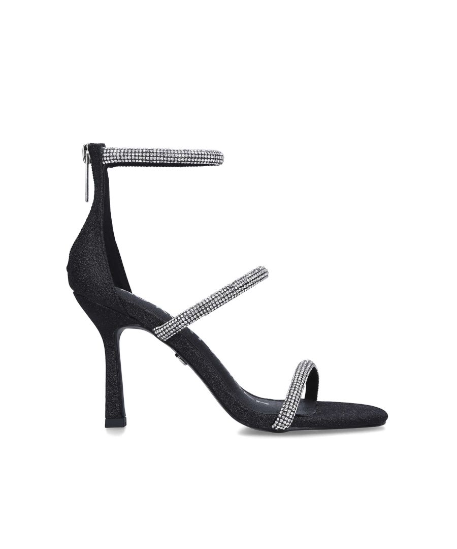 The Foster Sandal arrives with a black fabric upper and three straps across the foot that are embellished with silver crystals. The heel is in a stiletto style which is also embellished. Heel height: 10cm. This product is registered with The Vegan Society.