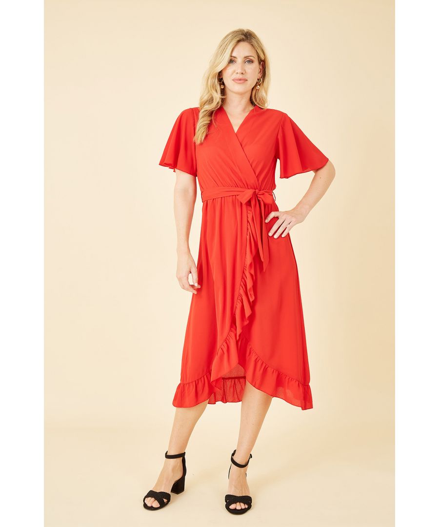 A simple and chic wrap dress, perfect for invites all season long. In a flattering wrap around shape,  with a matching belt at the waist and flowy and feminine frill details that cascade down the hemline. Wear this to weddings and summer plans all season long.