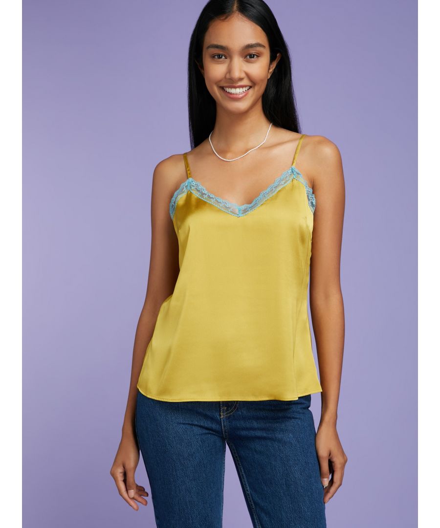 No wardrobe is complete without a lace cami and Yasmin ticks all the boxes. Fluid and sheer in a transluscent recycled polyester fabric that hangs beautifully, this golden-green hue top is detailed with adjustable straps, a low V-neck and a lace trim. Team with our Ambretta Tie Front Top for a sleepwear as daywear look with a 90s-inspired twist.