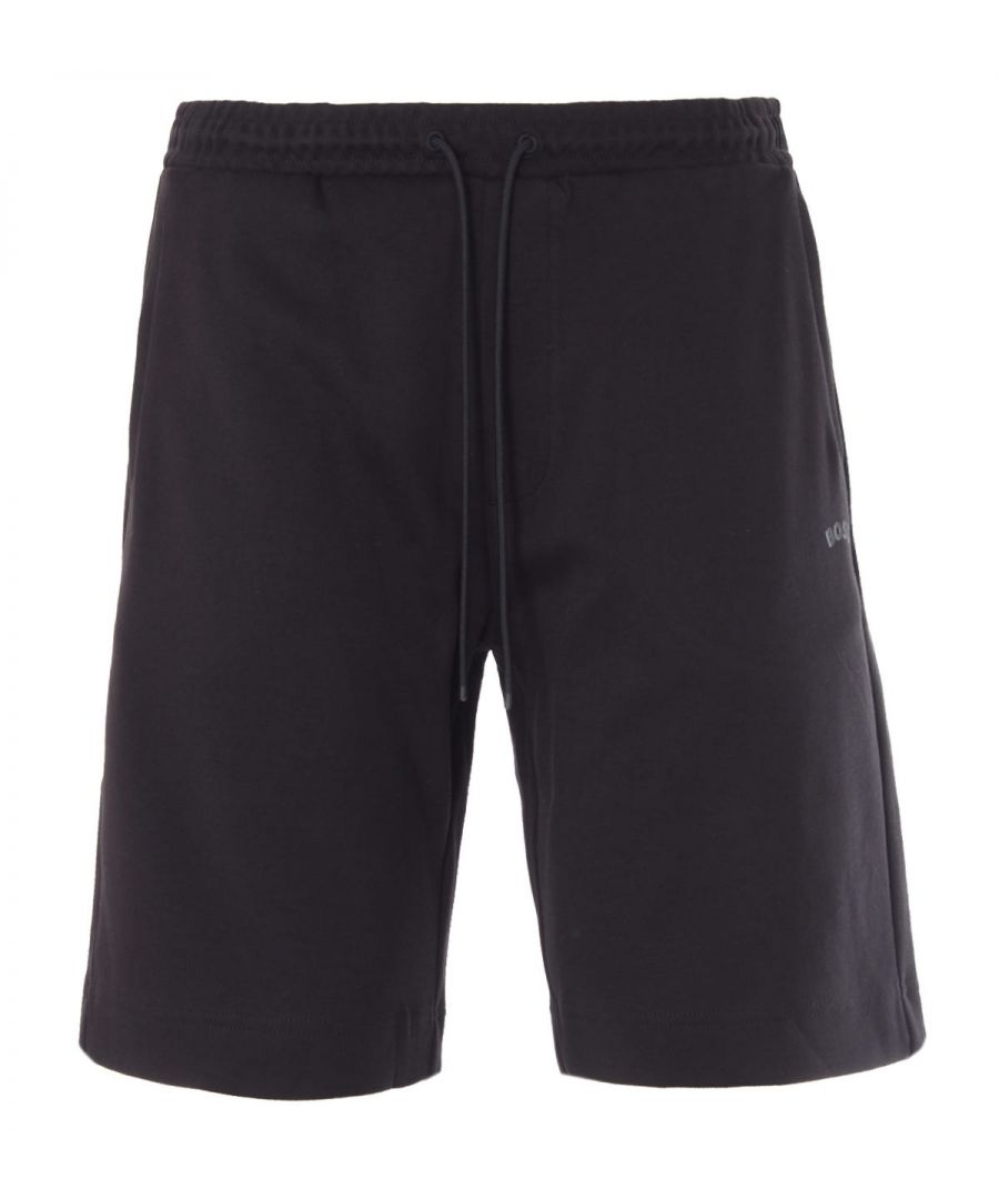 The Headlo Curved Logo Shorts from BOSS Athleisure are the perfect pair to refresh your wardrobe with contemporary sports style. Crafted from organic cotton and features an elasticated drawstring waist, side seam pockets, a rear welt pocket and a rear panel in tonal pique fabric for an athletic look. Finished with the curved BOSS logo printed at the left leg.Regular Fit, Stretch Cotton Blend Interlock, Elasticated Drawstring Waist, Side Seam Pockets, Rear Welt Pocket, Rear Tonal Pique Detailing, BOSS Branding. Fit & Style:Regular Fit, Fits True to Size. Composition & Care:100% Organic Cotton, Machine Wash.