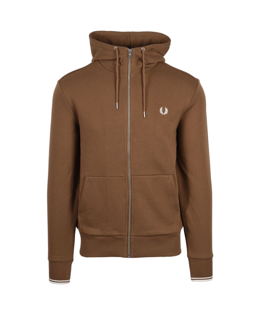 Fred Perry Zip Through Sweat Shaded Stone\nA full zip hooded sweatshirt with pockets, tipped cuffs and of course the iconic laurel wreath embroidered to the chest. In a fantastic new colourway this casual piece will take you from season to season.\n\n100% Cotton\nFull Zip\nDrawstring Hood\nSignature Fred Perry Branding\nStyle: J7536