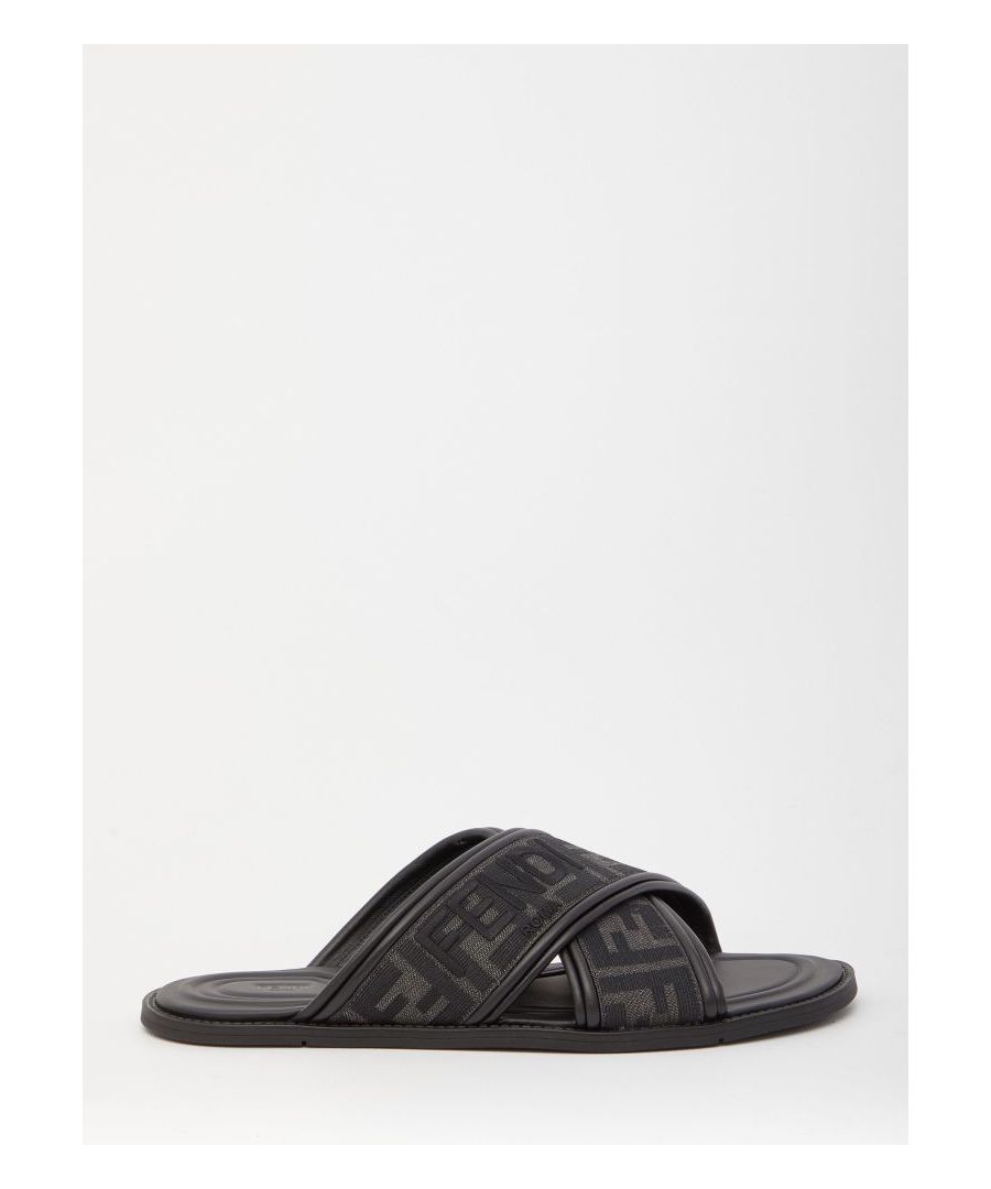 Black and grey fabric sandals with jacquard FF motif with black leather details. They feature cross-over bands, embroidered Fendi Roma lettering and non-slip rubber soles.