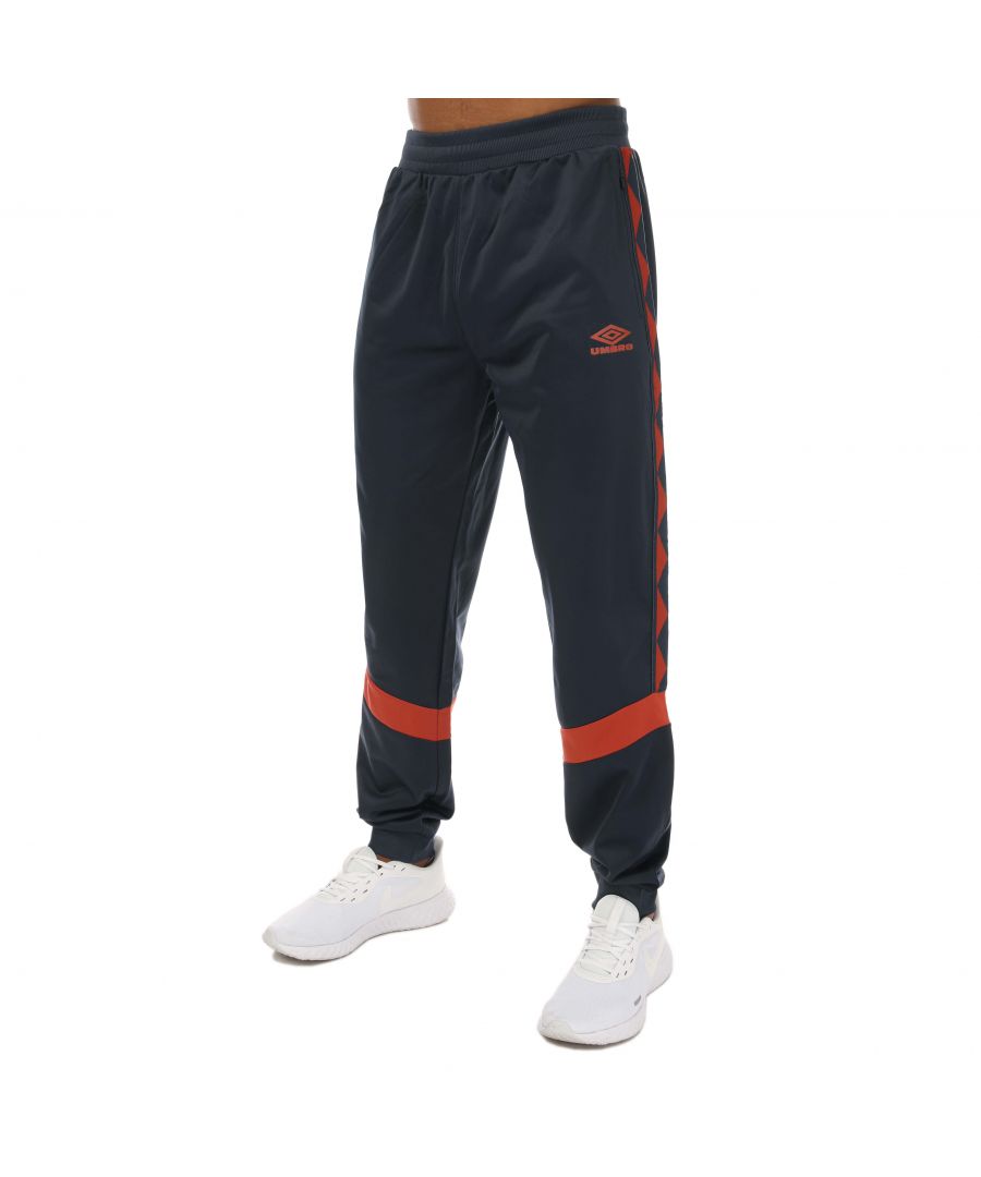 Mens Umbro Diamond Taped Tricot Track Pants in navy.- Elasticated waistband.- Two zipped pockets.- Back pocket.- Contrast insert.- Cuffed ankle.- Skinny fit.- Body: 100% Polyester. Rib: 95 Polyester  5% Elastane.- Ref: UMJM0645OG6NAV