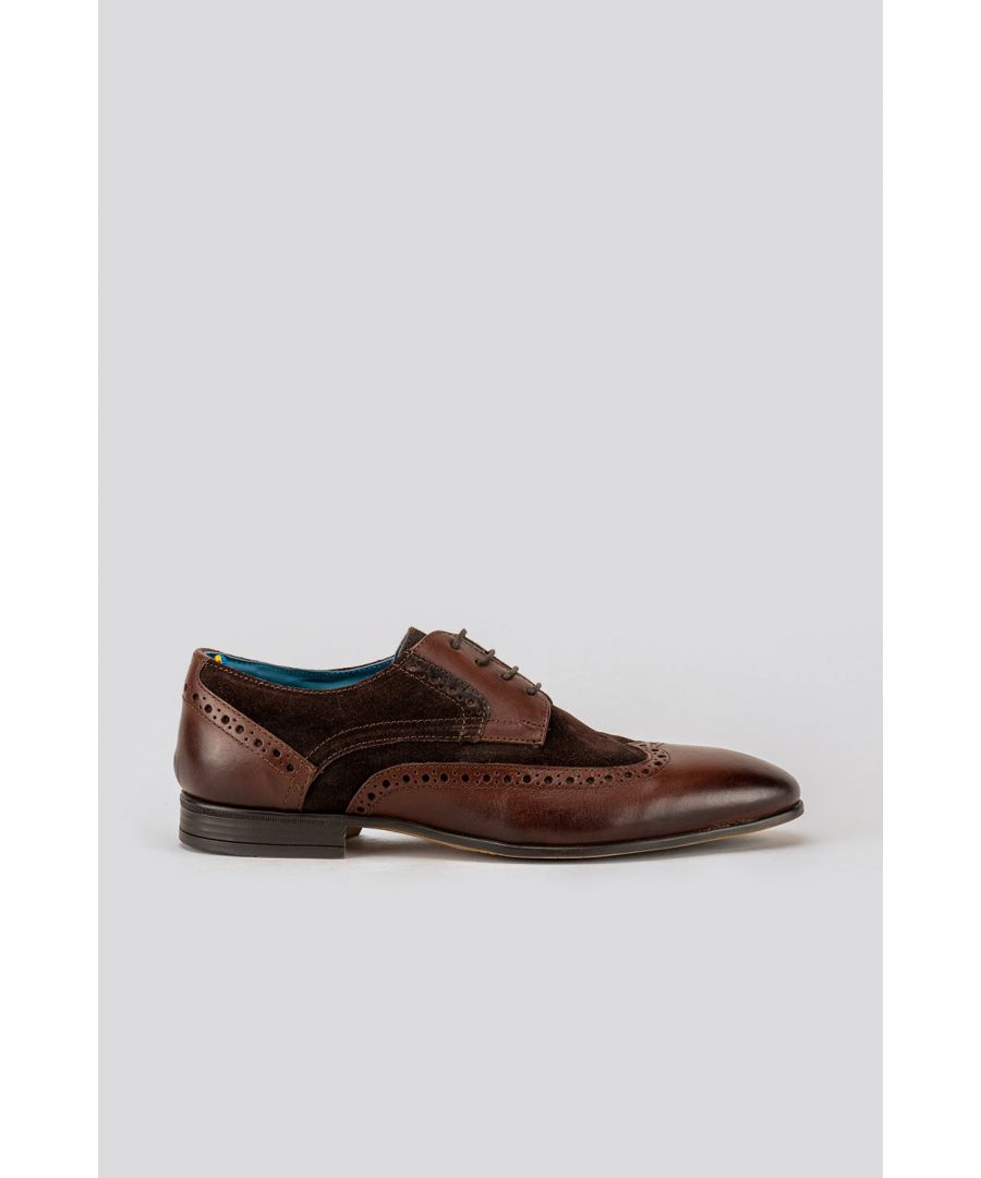 A classic Derby style shoe met with premium brown leather upper with suede brown finish and lambskin lining introduces The Miles. A regular pointed toe complimented with an intricate, perforated brogue detailing makes this the ideal shoe to complete smart and sophisticated formal attire.\nOur insoles consist of extra padding, enhancing comfort, and reducing stress on the feet. An additional cellular cushion is added along the collar to further enhance comfort. Our soles are made from a flexible all-weather resin material to ensure durability without sacrificing comfort.Upper: LeatherLining: LambskinSole: Other MaterialsAll Oswin Hyde shoes come in 100% recycled packaging with complimentary storage bags, shoehorn and polish to keep your kicks looking their best.