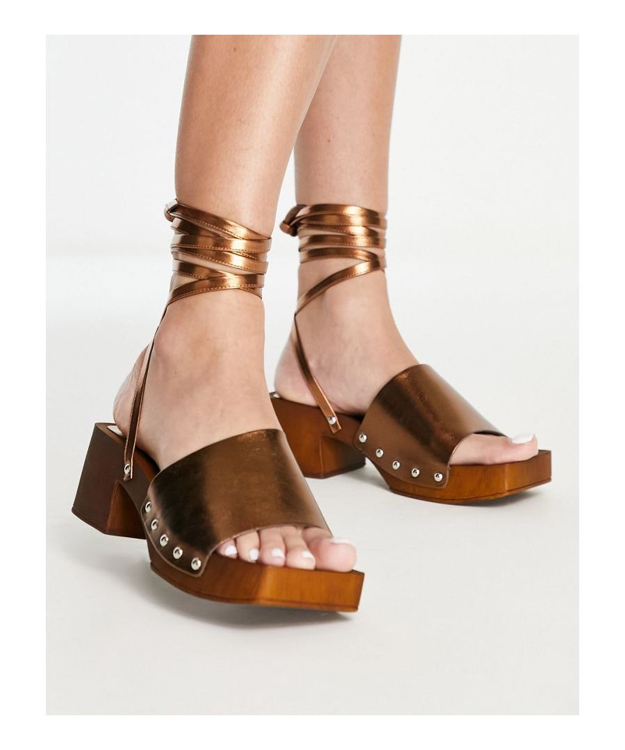 Sandals by Topshop Dress from the feet up Tie-leg design Open toe Chunky sole Mid block heel Wide fit  Sold By: Asos