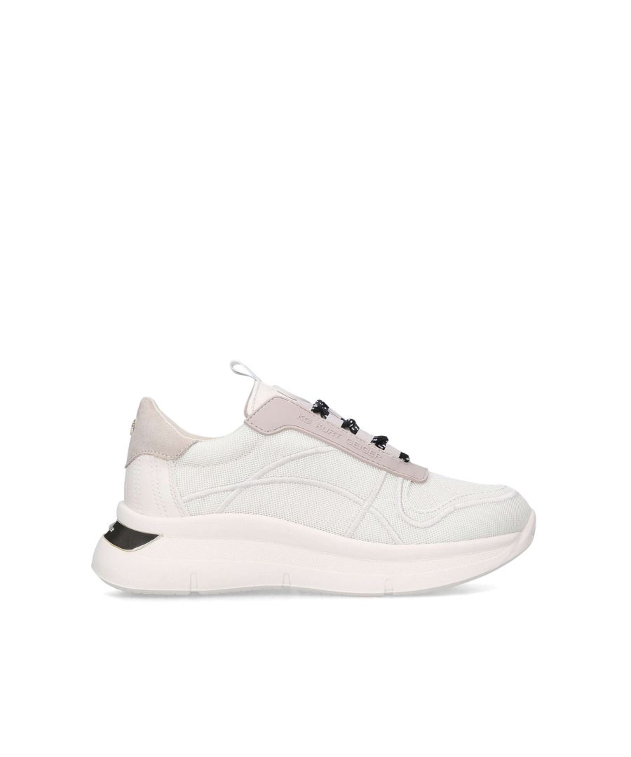 The Vegan Kaker mesh sneakers feature a stretch upper in a neutral bone. The lace up front sits above a white branded tab mirroring the same at the heel. The front uses two beige branded patches on the tongue.