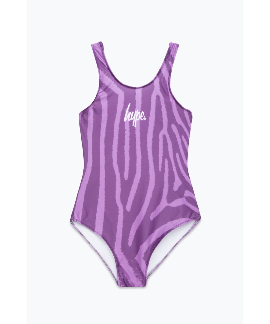Swim is in. Meet the HYPE. Girls Purple Zebra Swimsuit, the ultimate girls swimsuit you'll want to wear everyday of summer, autumn, winter and spring. Designed in our standard kids swimsuit shape, boasting an all over purple zebra print and the iconic HYPE. mini script logo in contrasting white. Wear with HYPE. sliders, swimming goggles and a beach towel in hand. Machine wash at 30 degrees.