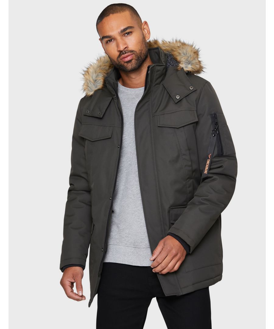 This padded jacket by Threadbare comes with two deep front pockets, two chest pockets and a zip pocket on the sleeve. This style features a faux fur trimmed hood and storm guard concealing the zip fastening. Other colours available.