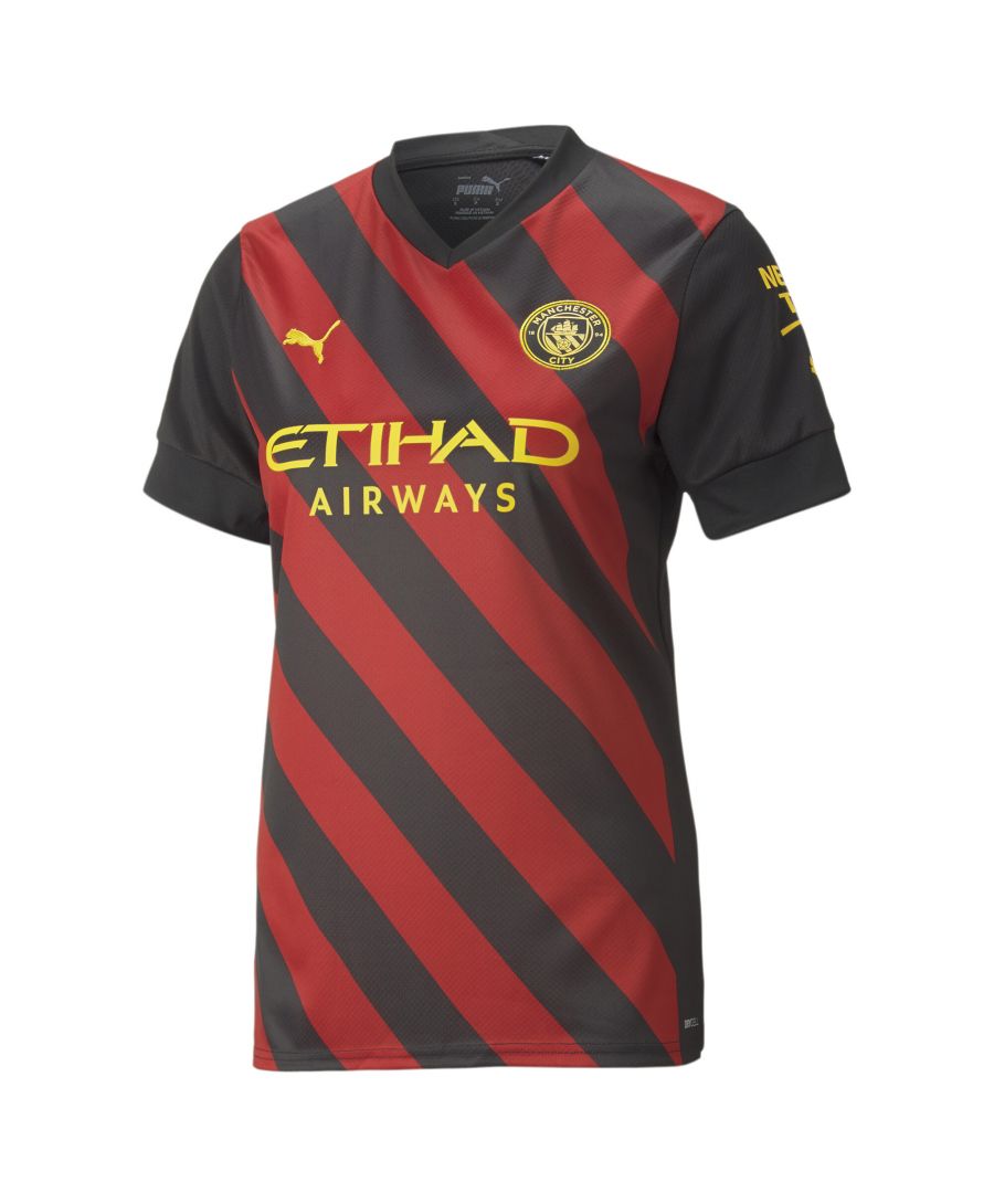 PRODUCT STORY .City put on a show. When the class of 1969 took to the road, they turned heads with their fearless, technically adept football – and their bold and brilliant new away strip. Conceived by the legendary Malcolm Allison, vertical stripes of red and black proved triumphant at the 1969 FA Cup Final, and the 1970 League Cup and European Cup Winners’ Cup finals, earning their place among all-time fan favorites. The 2022/23 Manchester City F.C. Away kit breathes new energy into a classic design. For the first time, red and black stripes flow down the jersey at an angle, inspired by the club crest and representation of the three Manchester rivers.   FEATURES & BENEFITS .dryCELL: Performance technology designed to wick moisture from the body and keep you free of sweat during exerciseMidori: Made with the bio-based finishing treatment miDori® bioWickRecycled Content: Made with 100% recycled material excluding trims & decorations as a step toward a better future DETAILS .Regular fitSet-in sleeve construction with raglan back seamFlat knit v-neckEmbroidered PUMA Cat Logo on the chest and sleevesOfficial team crest on the chest