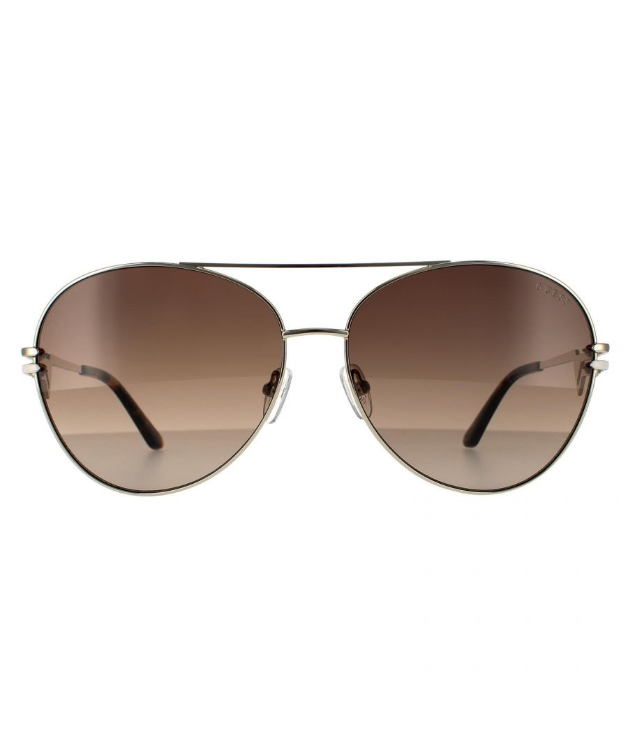 Guess Aviator Womens Gold Brown Gradient Sunglasses GU7735 are a lovely pilot style with a Guess twist. Here the typical Guess triangle logo appears in double form on the temples in a unique piece of Guess branding that looks superb
