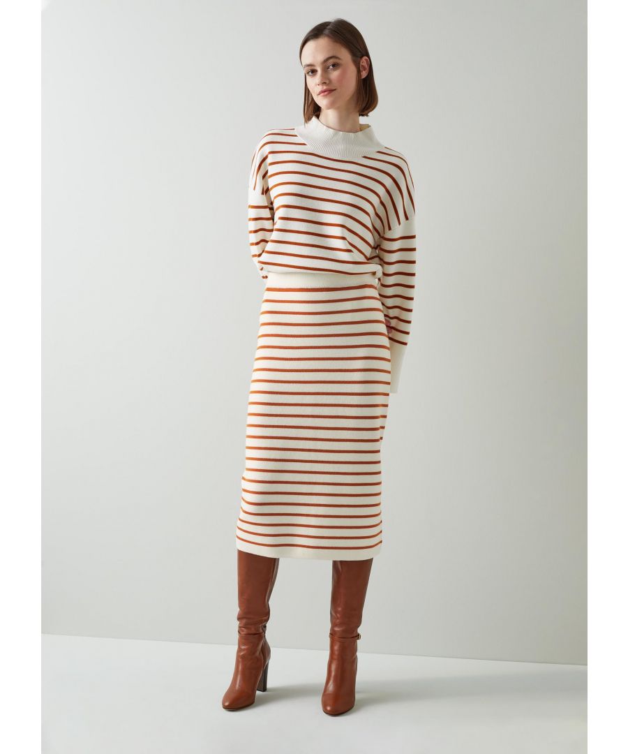 One of our favourite transitional duos, our Louise knitted skirt makes the perfect between-seasons look when paired with the matching jumper. Crafted from beautifully-soft and warm merino wool in cream with marmalade horizontal stripes (which hint at the arrival of spring), it sits on the waist, simply pulls on and falls to just below the knee. Wear it with the Louise jumper tucked in and a pair of long leather boots.