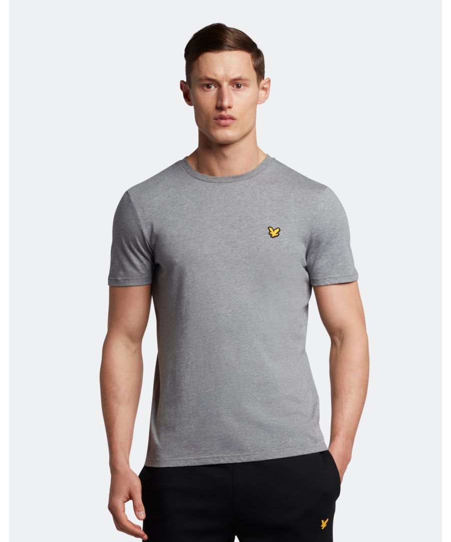 Made from a durable, lightweight cotton-polyester blend, the Lyle & Scott Martin Tee is a must-have for any sportsman this season. Perfect for hitting the gym, heading for a kickabout, or even slow days at home, this tee can be paired with almost anything and is available in an array of colours. Featuring detail stitching at shoulder, collar, and cuff, plus our signature Golden Eagle.Fit: Regular\nIt is crafted to fit the body neither too tightly or too loosely, leaving you with a classic, timelessly stylish look. We recommend you order your usual size, but if you're caught between two, go a size up.