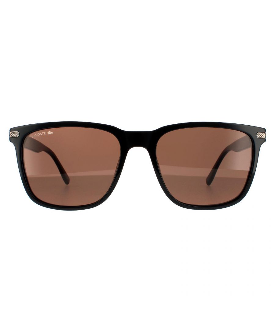 Lacoste Sunglasses L898S 001 Black Grey are a typical wayfarer style and made entirely of lightweight acetate. A textured metal plaque wraps around the outer corners of the frame and temple tips are branded with the Lacoste text logo.